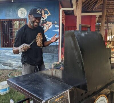King Jerk Grill's signature jerk chicken platter served with traditional sides in San Juan del Sur, Nicaragua