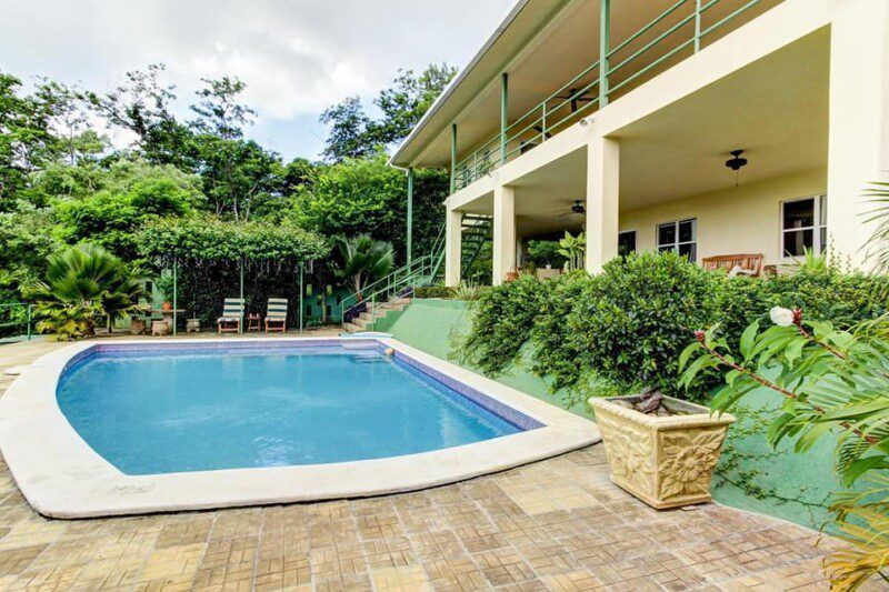 Exterior view of Green Acres Hewitt Home & Guest House surrounded by lush greenery in Hewitt, Texas