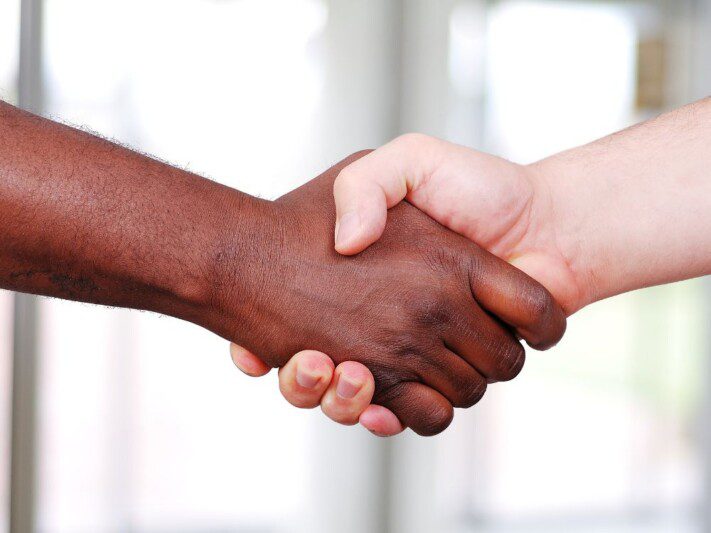 a close-up of a handshake: Hiring Workers in Nicaragua