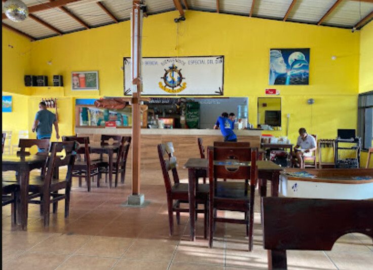 La Lancha restaurant interior with lakeside view and outdoor seating in San Juan del Sur, Nicaragua