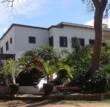 Arte-Sano Hotel Cafe's outdoor pool area with ocean view in San Juan del Sur, Nicaragua