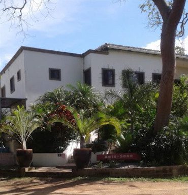 Arte-Sano Hotel Cafe's outdoor pool area with ocean view in San Juan del Sur, Nicaragua