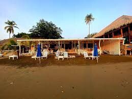 Exterior of Restaurante El Velero showcasing vibrant decor and live music setup in Granada, Nicaragua