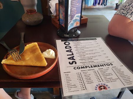 Interior of Babushka Crepes showcasing a variety of sweet and savory crepes in San Juan del Sur, Nicaragua