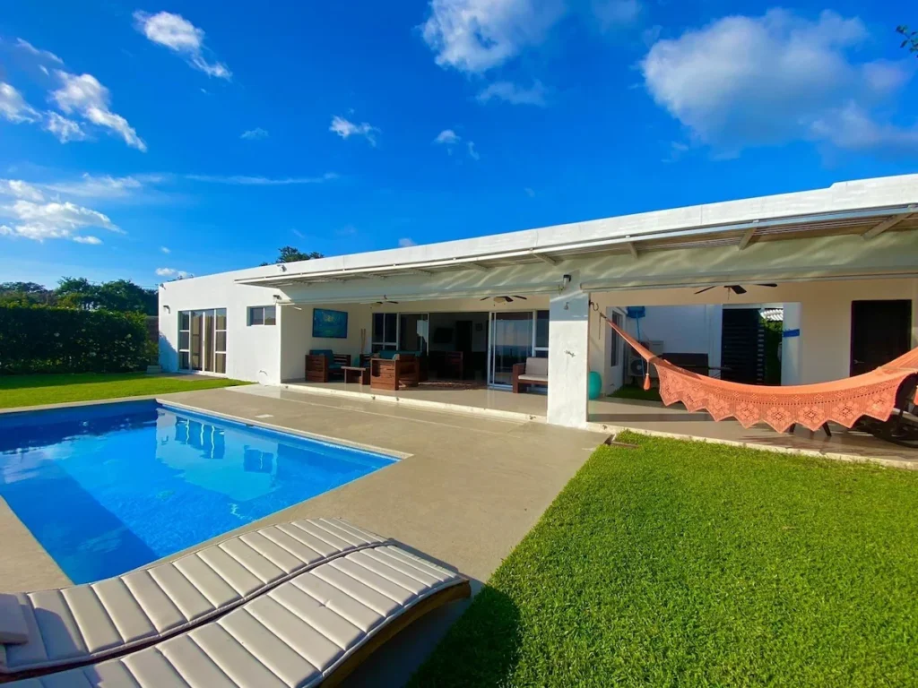 Exterior view of Casa Buenavista with private pool overlooking the Pacific Ocean and mountains in San Juan del Sur