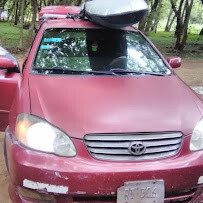 Henry Taxi Safe Nicaragua private car parked on San Juan del Sur road with driver