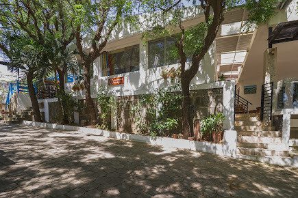 Surfer riding a wave at Coconut Surf surf camp near San Juan del Sur