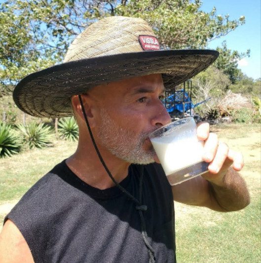 Fresh raw Jersey cow milk in glass bottle from Farmer Paul near San Juan