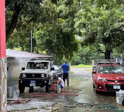 Exterior view of Car Wash Palermo in San Juan del Sur, Nicaragua, showcasing vehicle cleaning services