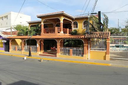 Hotel Gran Oceano with outdoor pool, lush garden, and tour options in San Juan del Sur, Nicaragua