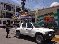 Surf coach guiding beginner surfers at Playa Maderas, Nicaragua