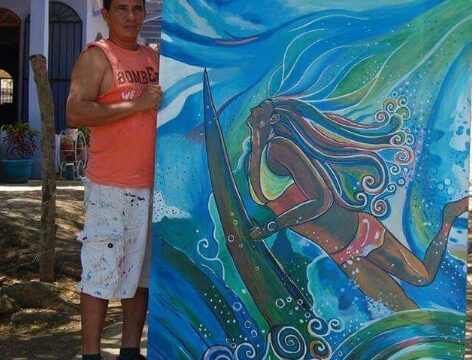 Artist Jairo Dangla painting mural and custom artwork in San Juan del Sur